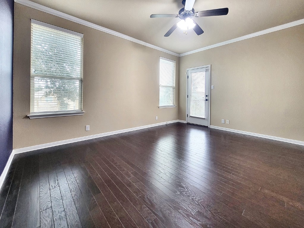 7508 Colina Vista Loop, Unit B Austin, TX 78750 - Photo 27 of 40 a view of an empty room with wooden floor and a window