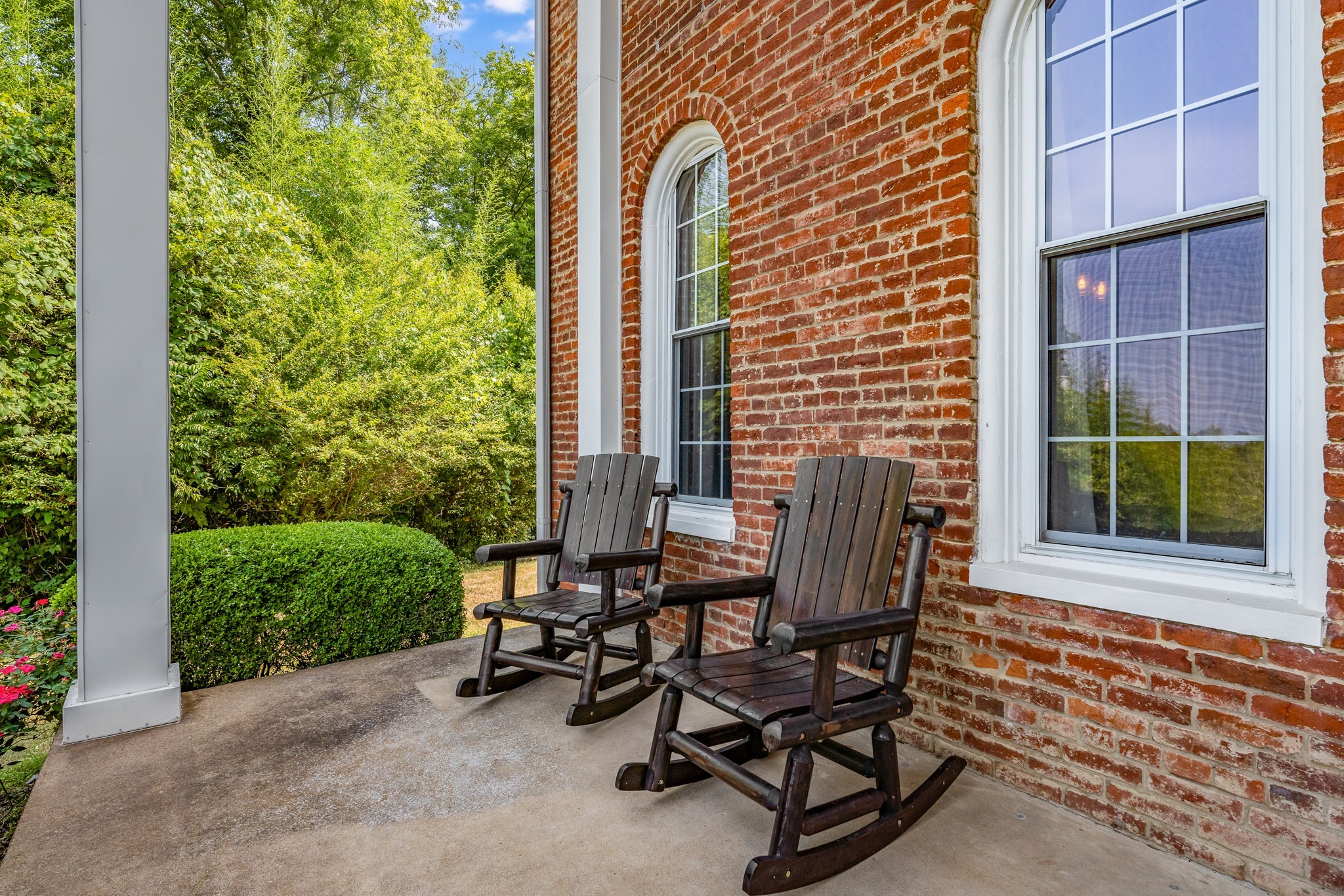 5704 Cane Ridge Road Antioch, TN 37013 - Photo 4 of 50 a view of a patio with table and chairs and potted plants