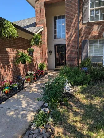 a view of a house with a backyard and sitting area