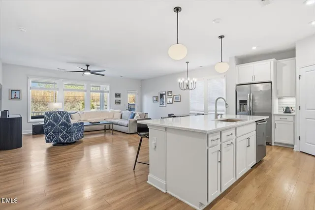 a spacious bedroom with a bed and a cabinets