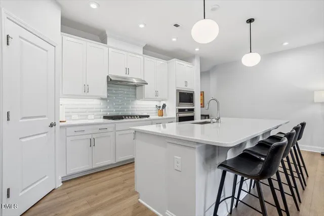 a bathroom with a shower and a sink