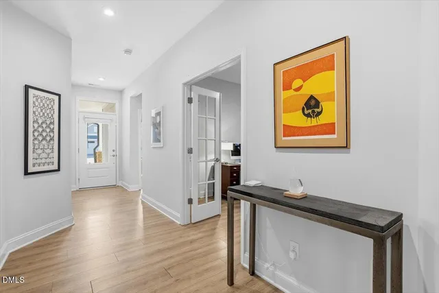 a bedroom with a bed and mirror