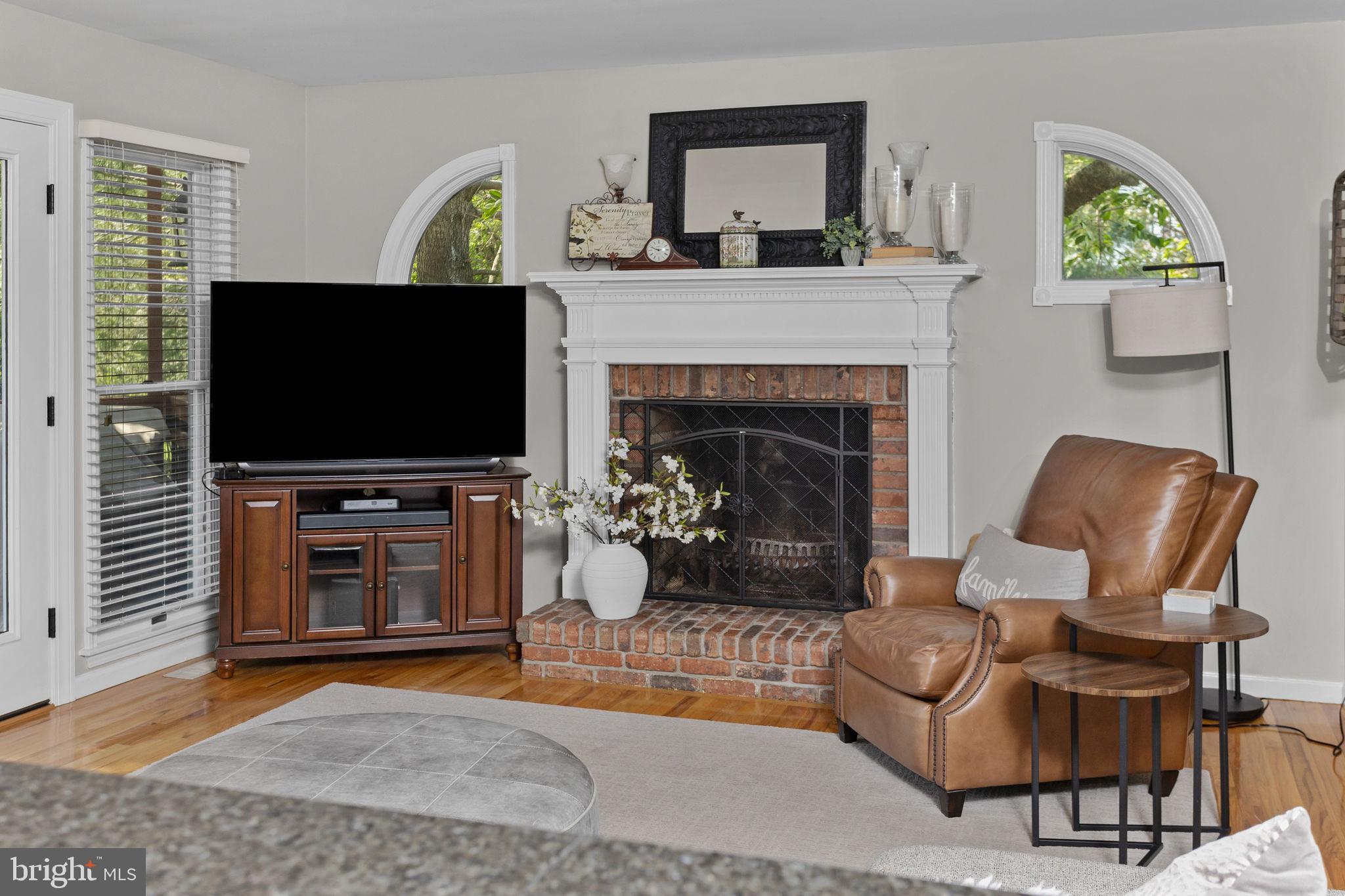 44 Walters Road Robbinsville, NJ 08691 - Photo 27 of 68 a living room with furniture a flat screen tv and a fireplace