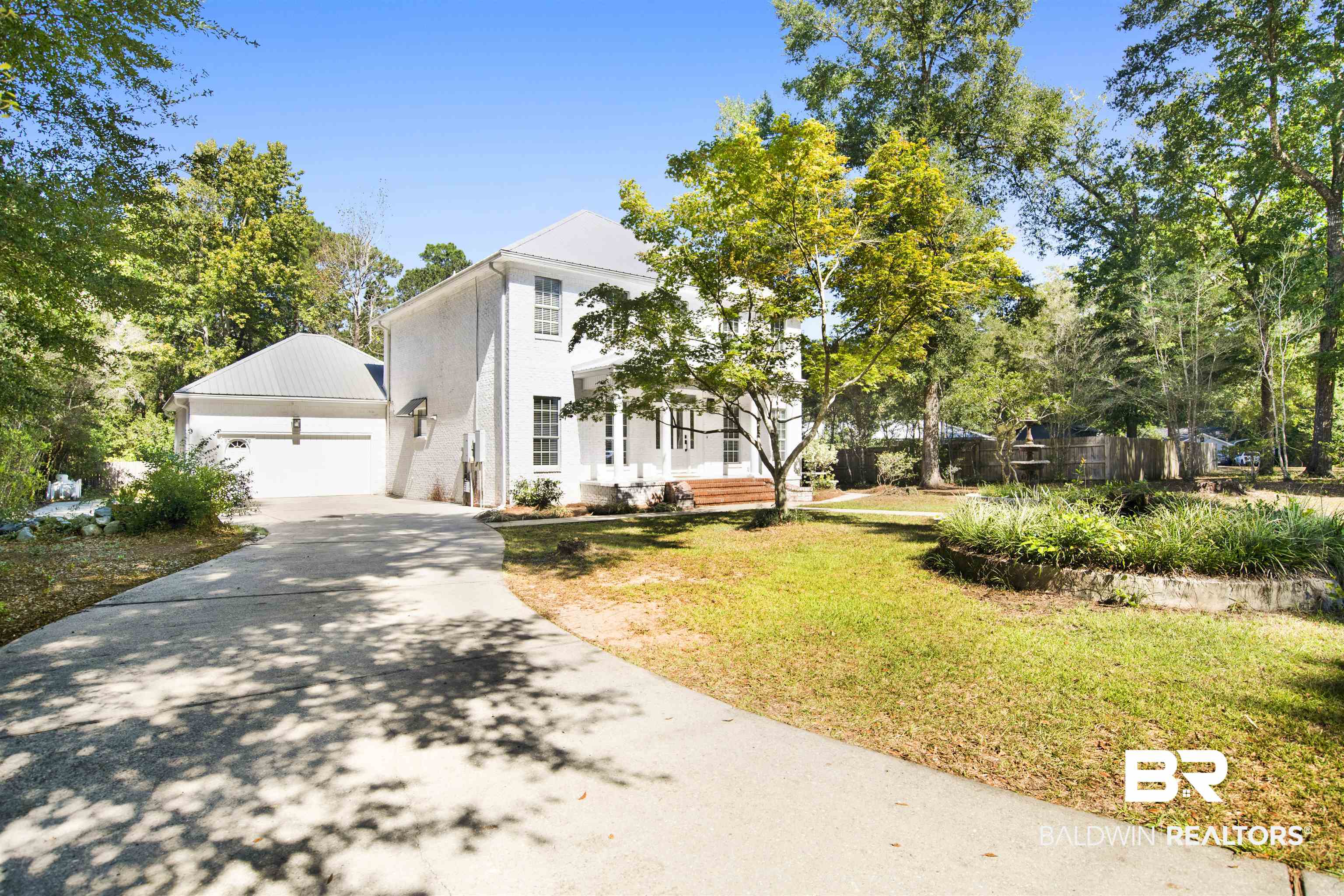 11835 Island Drive Foley, AL 36535 - Photo 43 of 53 Greek revival house with a front lawn and concrete driveway