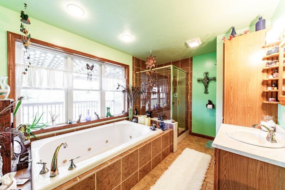 11 Fairgrounds Road Stoneboro, PA 16153 - Photo 12 of 37 a spacious bathroom with a tub sink and mirror