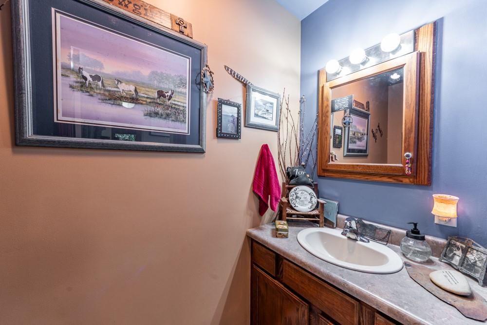 11 Fairgrounds Road Stoneboro, PA 16153 - Photo 14 of 37 a bathroom with a granite countertop sink and a mirror