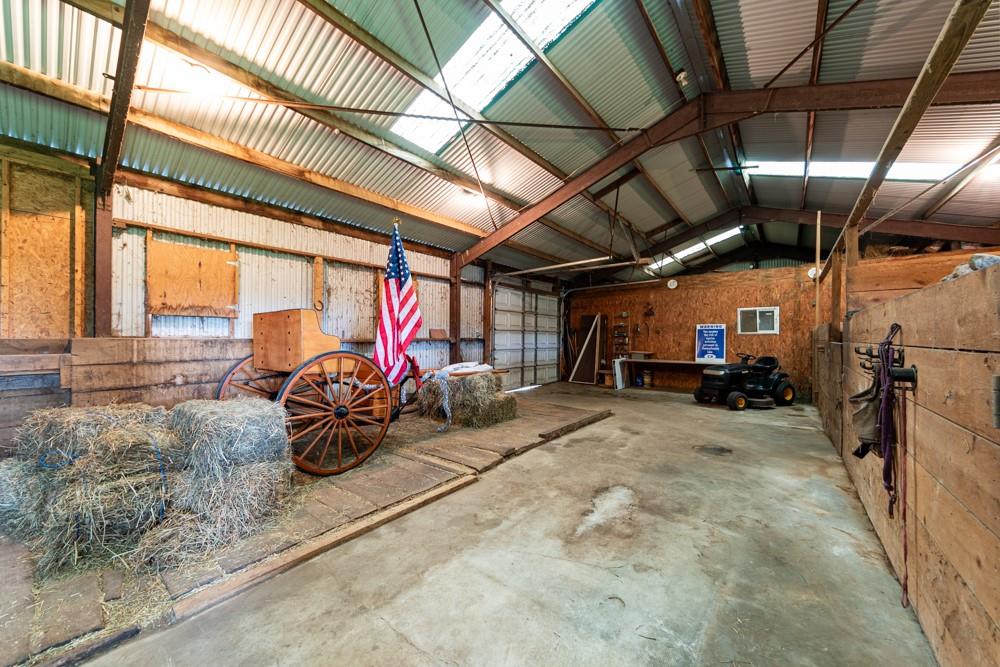 11 Fairgrounds Road Stoneboro, PA 16153 - Photo 19 of 37 a view of a garage with a table and chairs