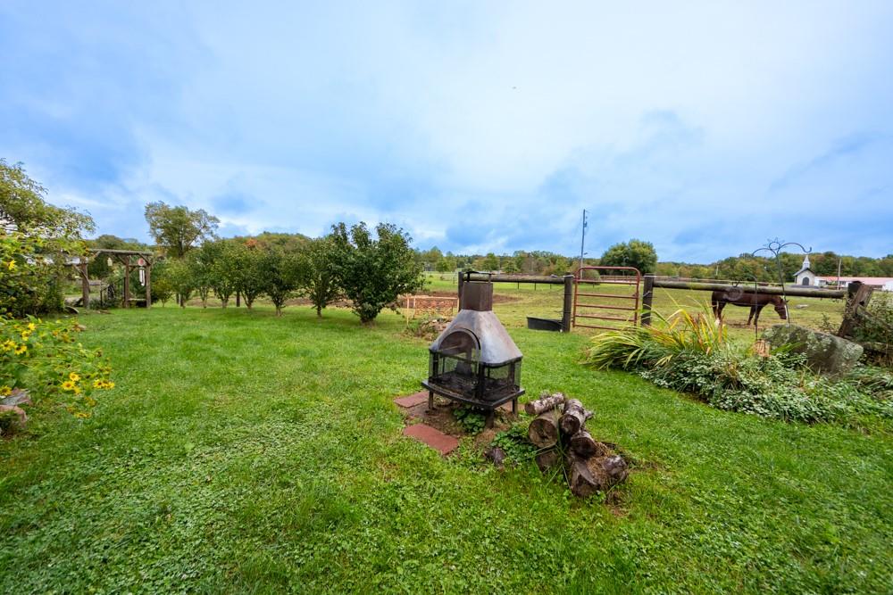 11 Fairgrounds Road Stoneboro, PA 16153 - Photo 29 of 37 a garden with trees in front of it