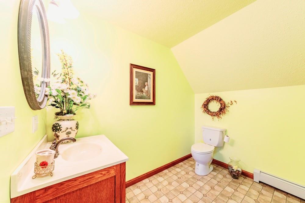 11 Fairgrounds Road Stoneboro, PA 16153 - Photo 36 of 37 a bathroom with a sink mirror vanity and toilet