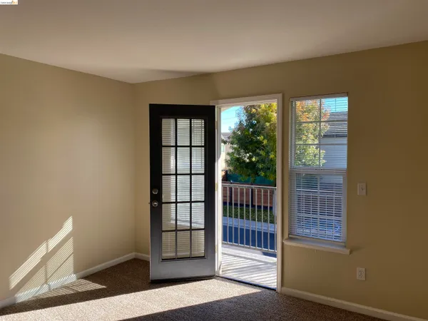 a view of wooden floor and windows in a room