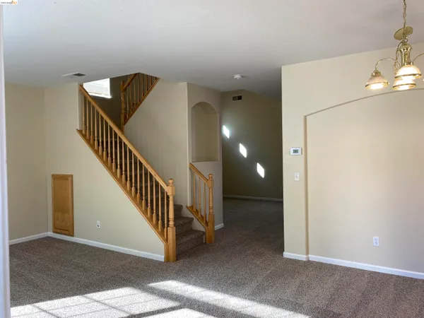 a view of a hallway with staircase
