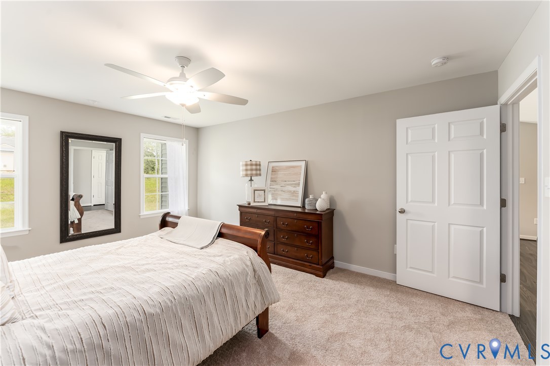 140 Wendenburg Court, Unit F6 Aylett, VA 23009 - Photo 22 of 33 Bedroom with light carpet and ceiling fan