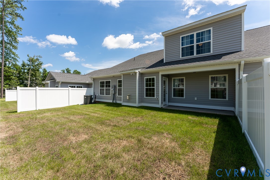 140 Wendenburg Court, Unit F6 Aylett, VA 23009 - Photo 29 of 33 Rear view of house with a shingled roof and a pati