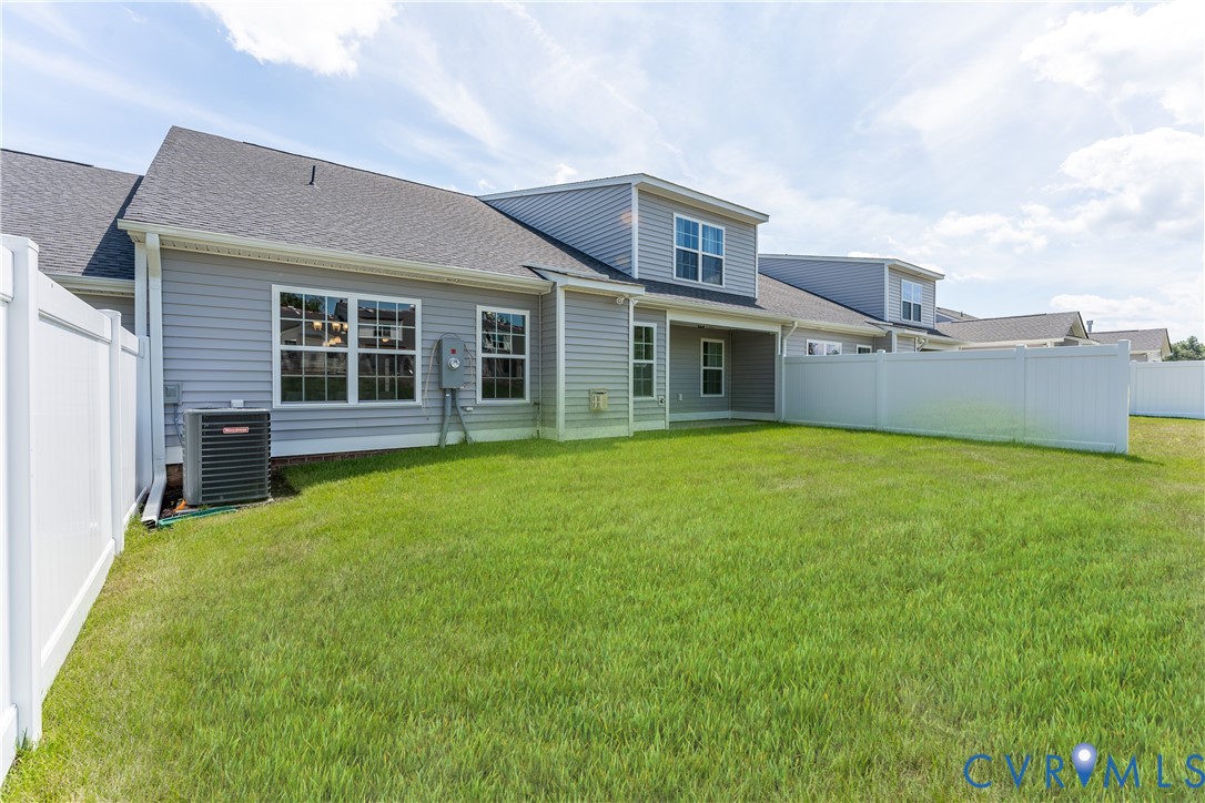 140 Wendenburg Court, Unit F6 Aylett, VA 23009 - Photo 31 of 33 Rear view of house with a fenced backyard and a sh
