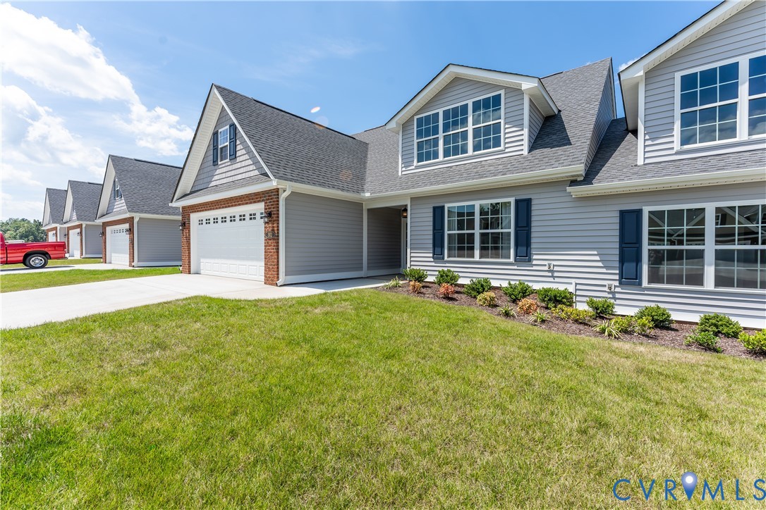 140 Wendenburg Court, Unit F6 Aylett, VA 23009 - Photo 32 of 33 View of front of house with a shingled roof, a gar