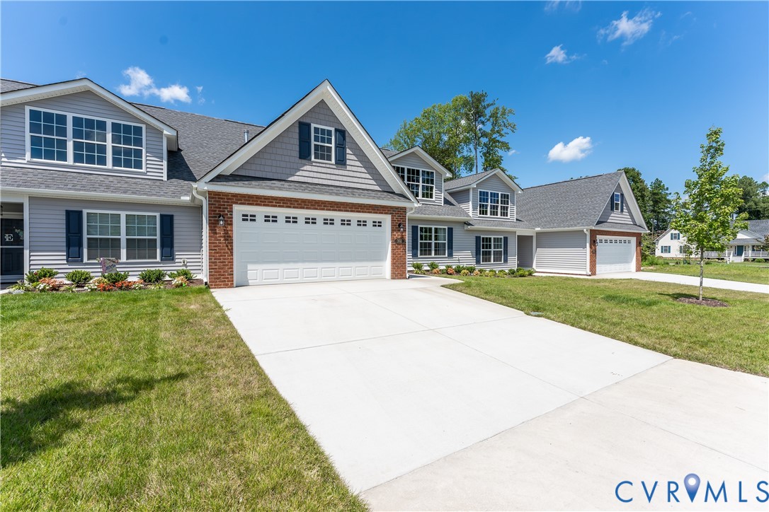 140 Wendenburg Court, Unit F6 Aylett, VA 23009 - Photo 33 of 33 View of front of home with a garage, driveway, and