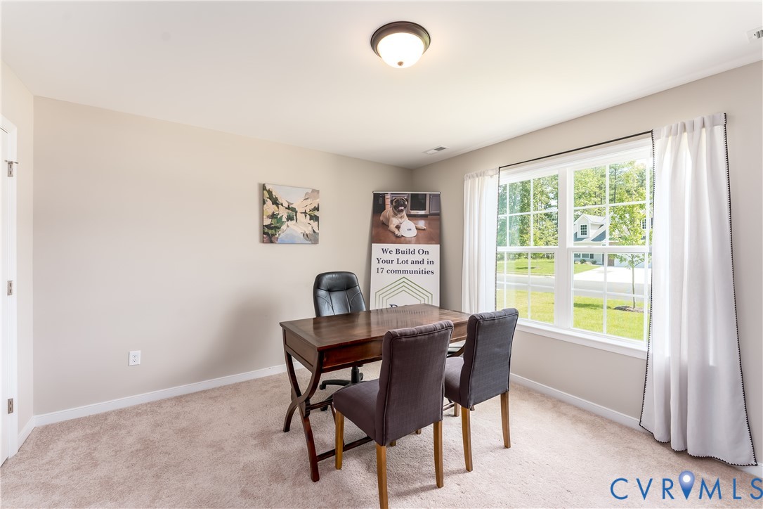 140 Wendenburg Court, Unit F6 Aylett, VA 23009 - Photo 6 of 33 Dining room with light carpet and an office area