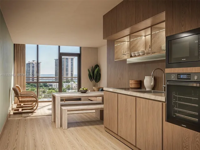 a kitchen with stainless steel appliances a sink and cabinets
