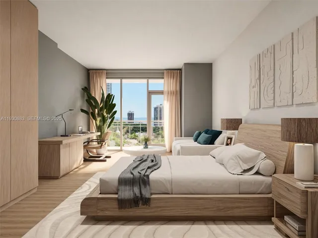 a living room with a large window and a wooden floor