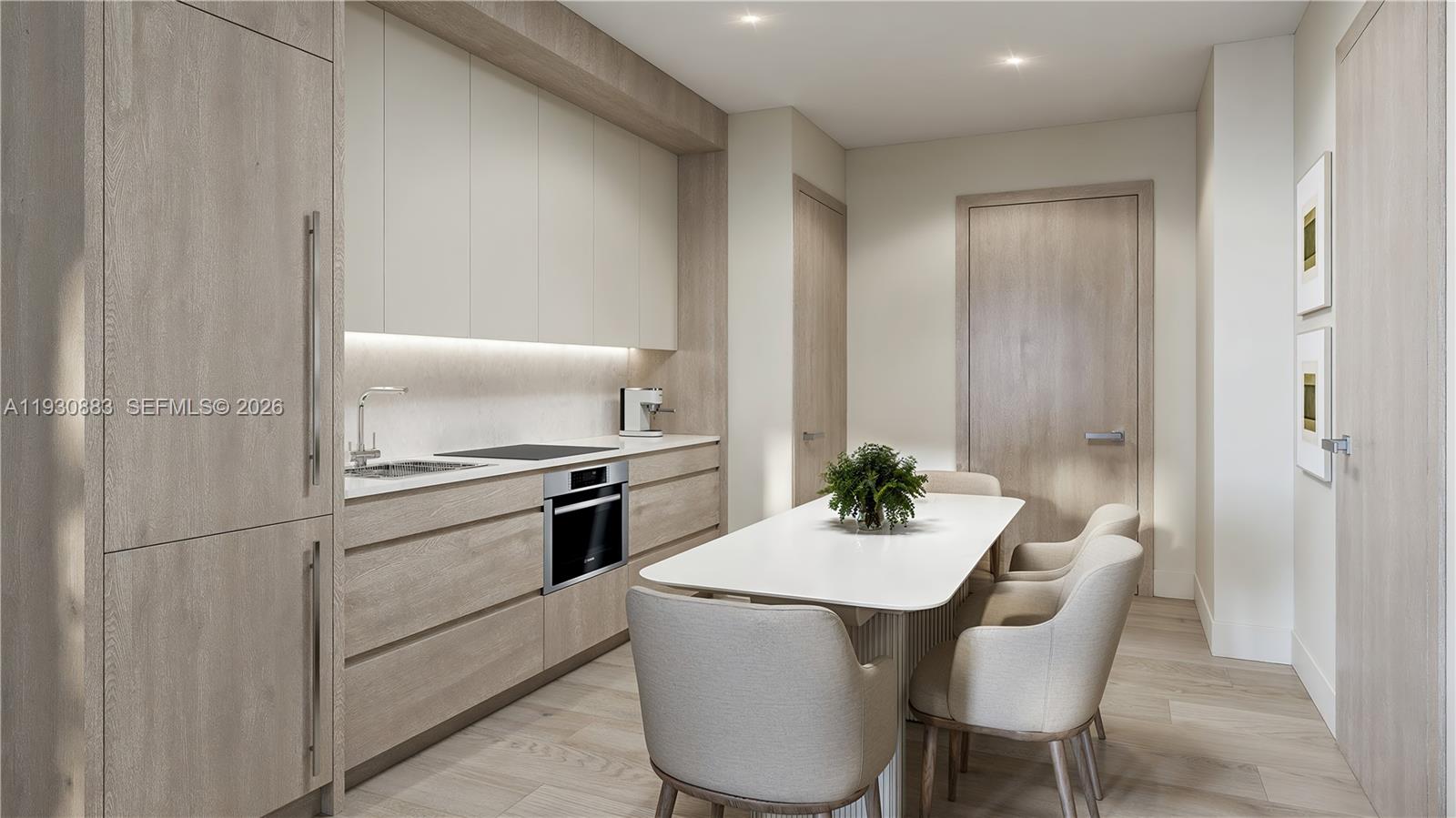 1741 Southwest 2nd Avenue, Unit 427 Miami, FL 33129 - Photo 4 of 20 a kitchen with a table and chairs