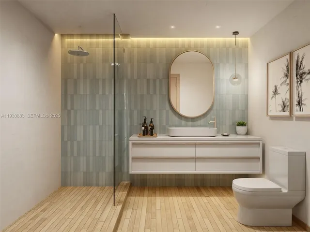 a bathroom with a sink mirror and vanity