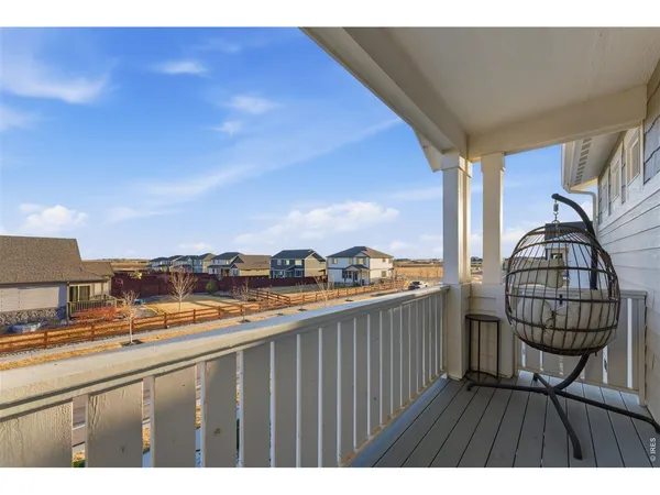 a view of a balcony with wooden floor and outdoor space