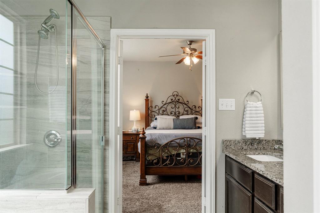 2716 Beutel Road Lorena, TX 76655 - Photo 21 of 39 a bedroom with a bed and a mirror