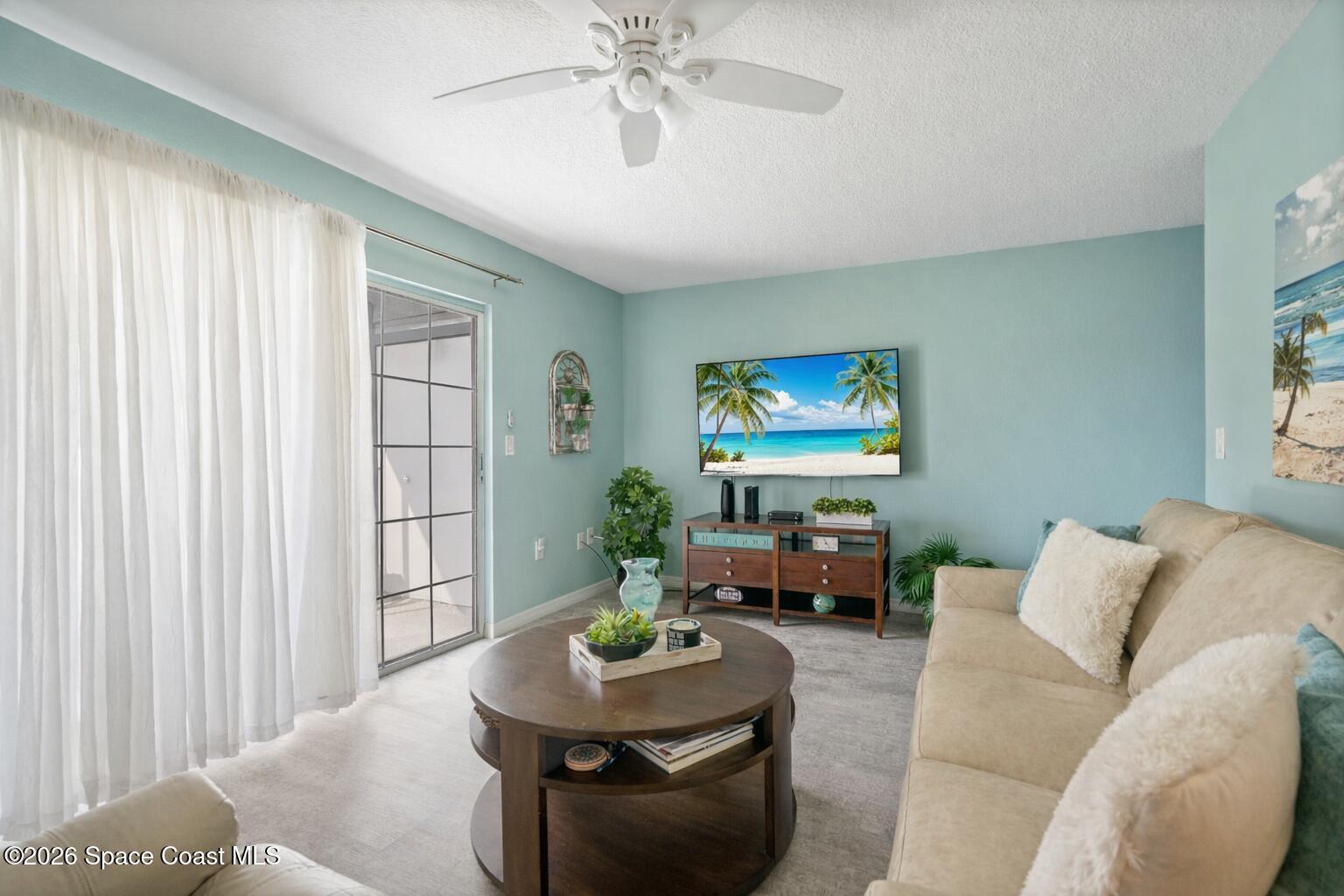 4610 Beck Lake Trail, Unit 1116 Melbourne, FL 32901 - Photo 20 of 49 living room with beach 1