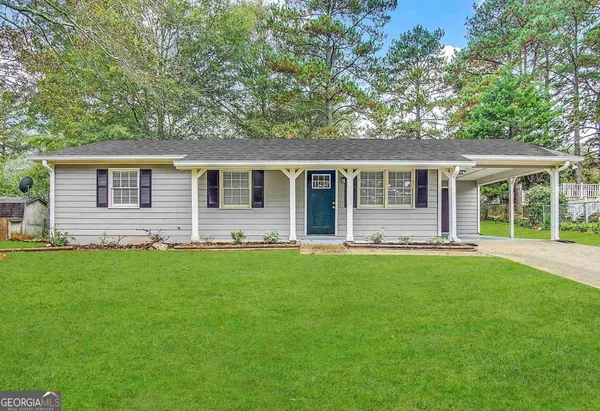 front view of a house with a yard