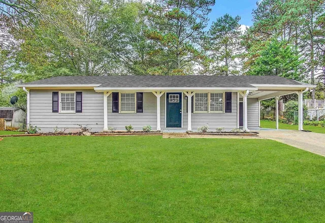 front view of a house with a yard