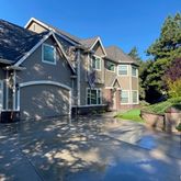 a view of a house with a street