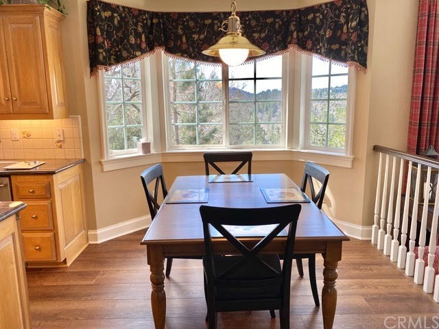 1010 Black Oaks Drive Lake Arrowhead, CA 92352 - Photo 20 of 52 a view of a dining room with furniture window and wooden floor