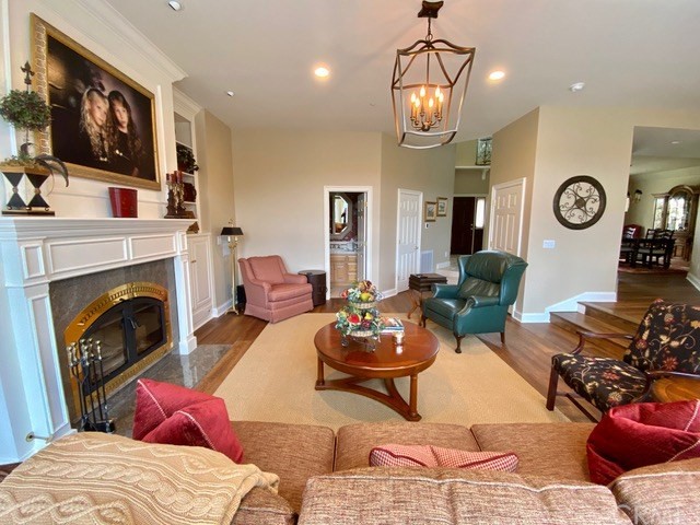 1010 Black Oaks Drive Lake Arrowhead, CA 92352 - Photo 25 of 52 a living room with furniture a flat screen tv and a fireplace