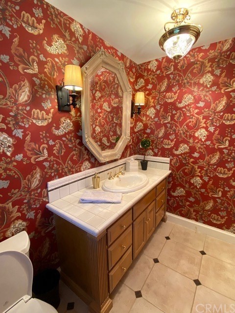 1010 Black Oaks Drive Lake Arrowhead, CA 92352 - Photo 28 of 52 a bathroom with a sink and a mirror