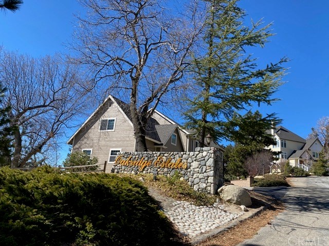 1010 Black Oaks Drive Lake Arrowhead, CA 92352 - Photo 43 of 52 a view of a house with a tree in the background