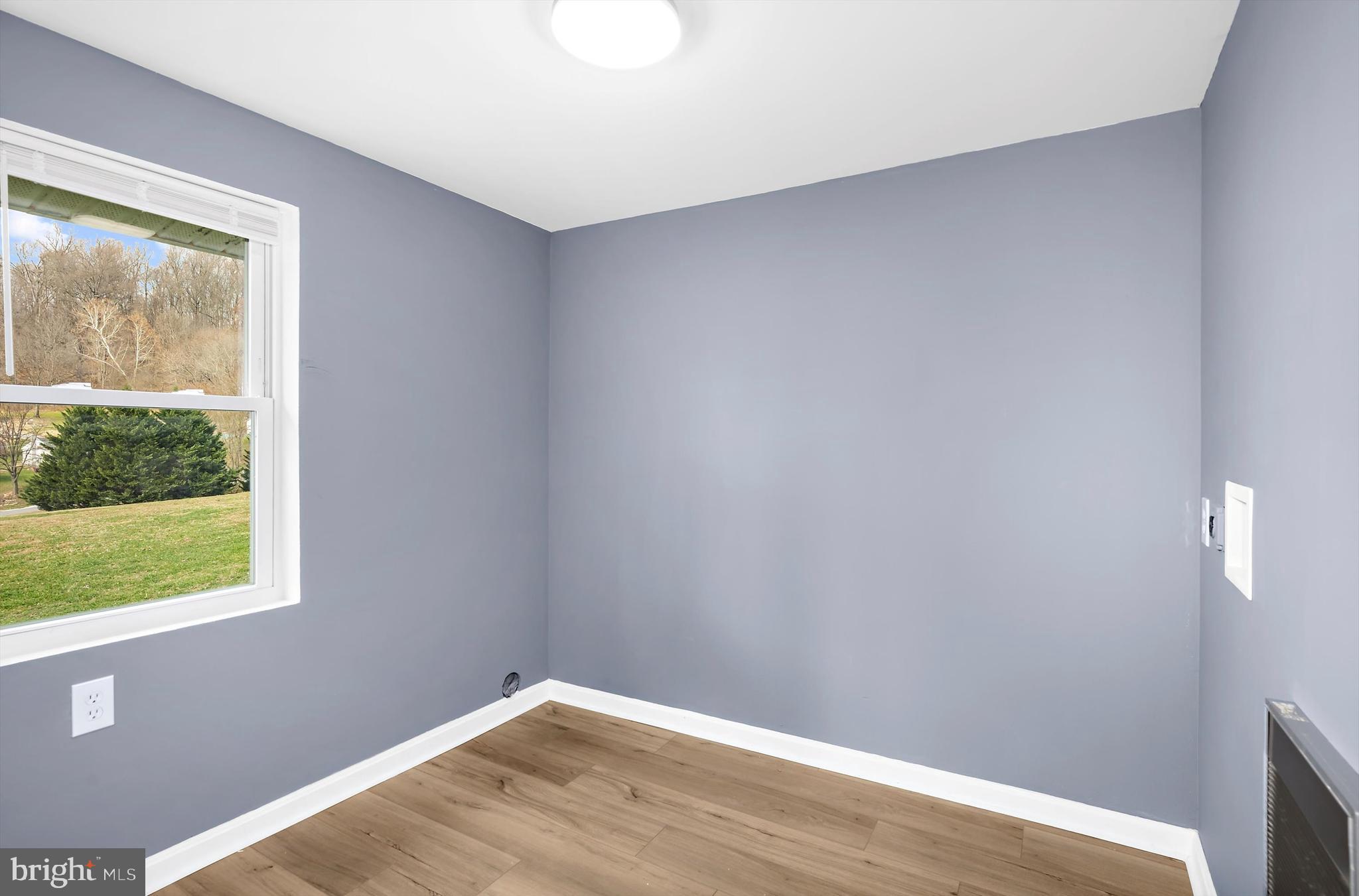 2219 Back Road Sharpsburg, MD 21782 - Photo 14 of 31 a view of a small space with wooden floor and a window