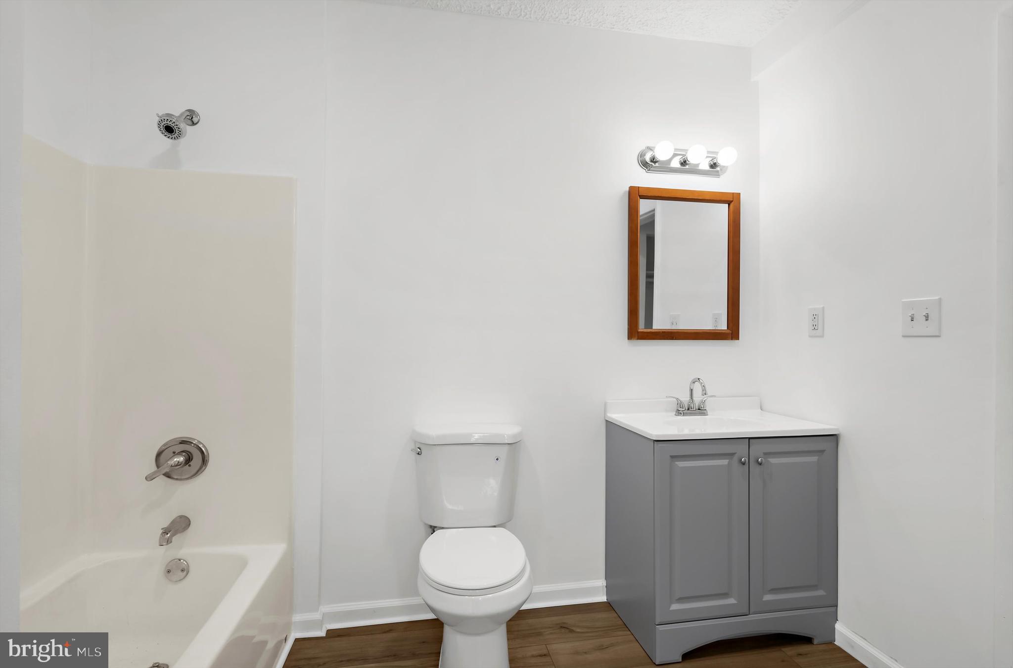 2219 Back Road Sharpsburg, MD 21782 - Photo 19 of 31 a bathroom with a toilet sink and mirror