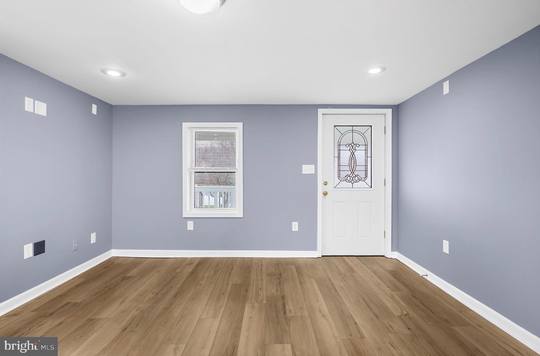 2219 Back Road Sharpsburg, MD 21782 - Photo 2 of 31 an empty room with wooden floor and windows