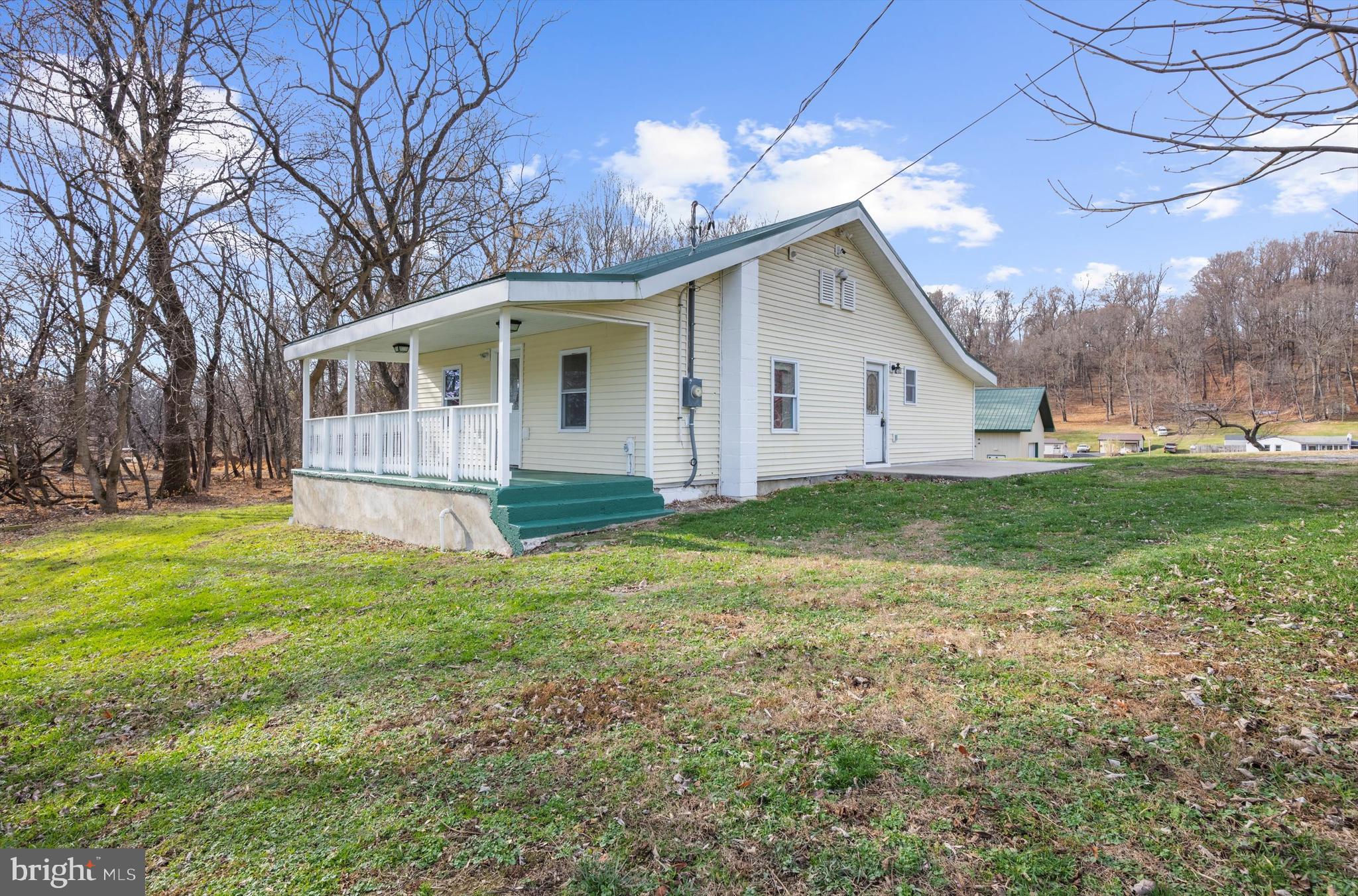 2219 Back Road Sharpsburg, MD 21782 - Photo 22 of 31 a front view of house with yard and green space