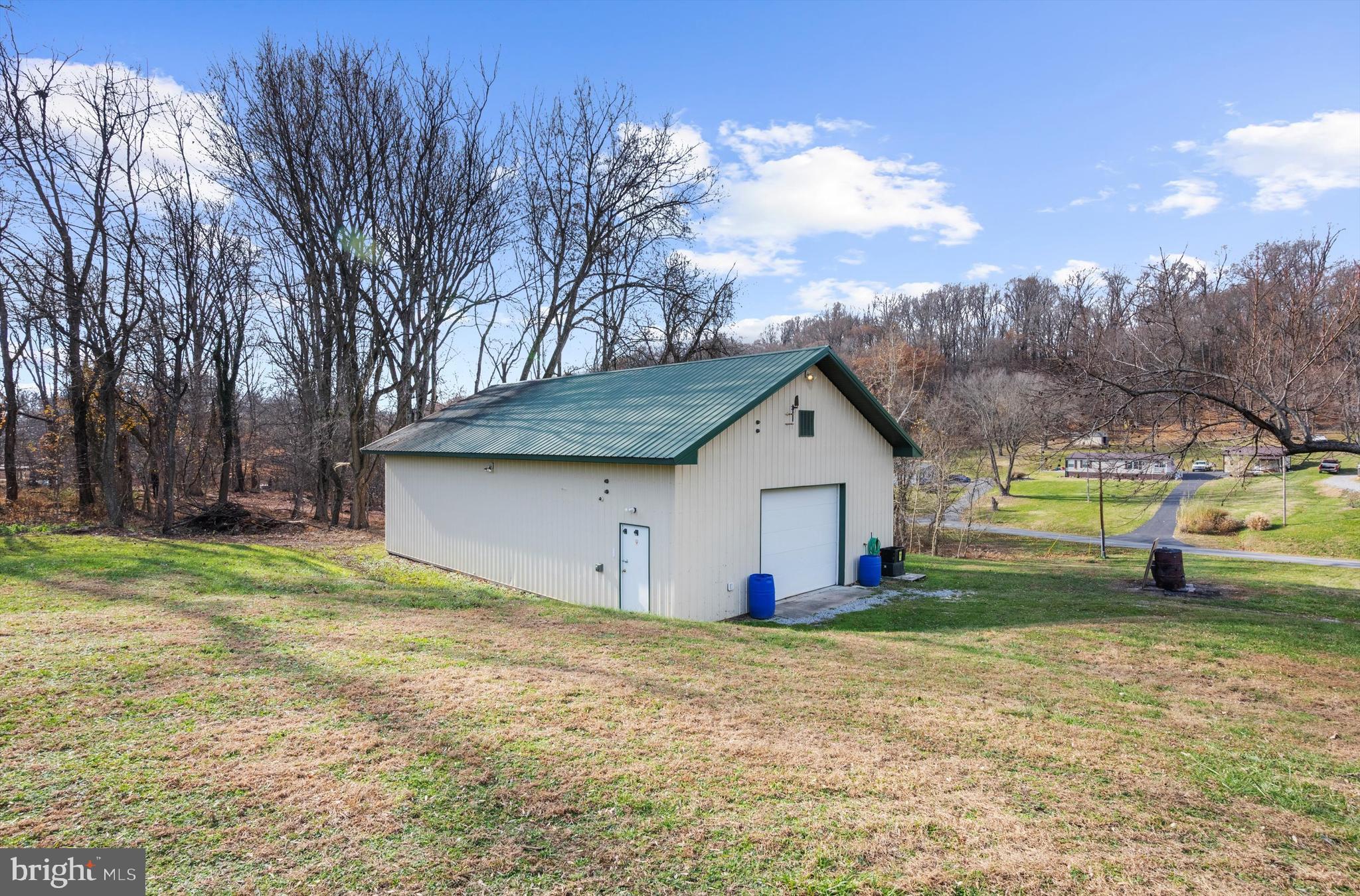 2219 Back Road Sharpsburg, MD 21782 - Photo 27 of 31 a view of a house with a yard and sitting area
