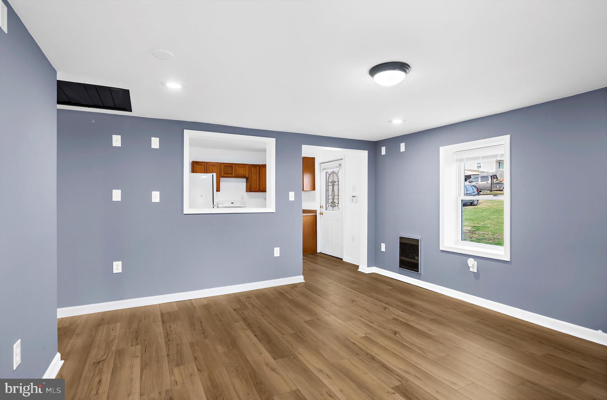 2219 Back Road Sharpsburg, MD 21782 - Photo 5 of 31 a view of an empty room with wooden floor and a window