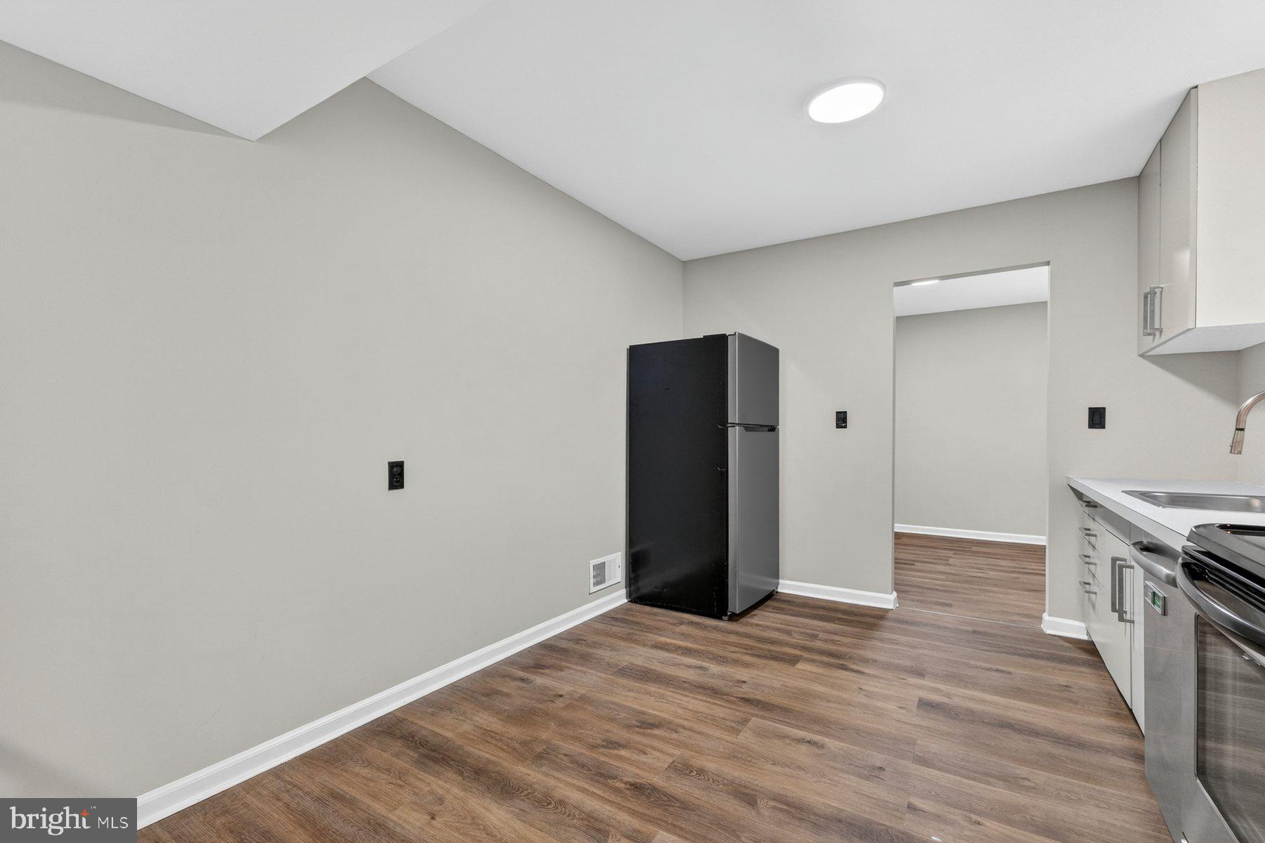 4810 A Wheeler Road Temple Hills, MD 20748 - Photo 18 of 28 Modern kitchen with sleek finishes.