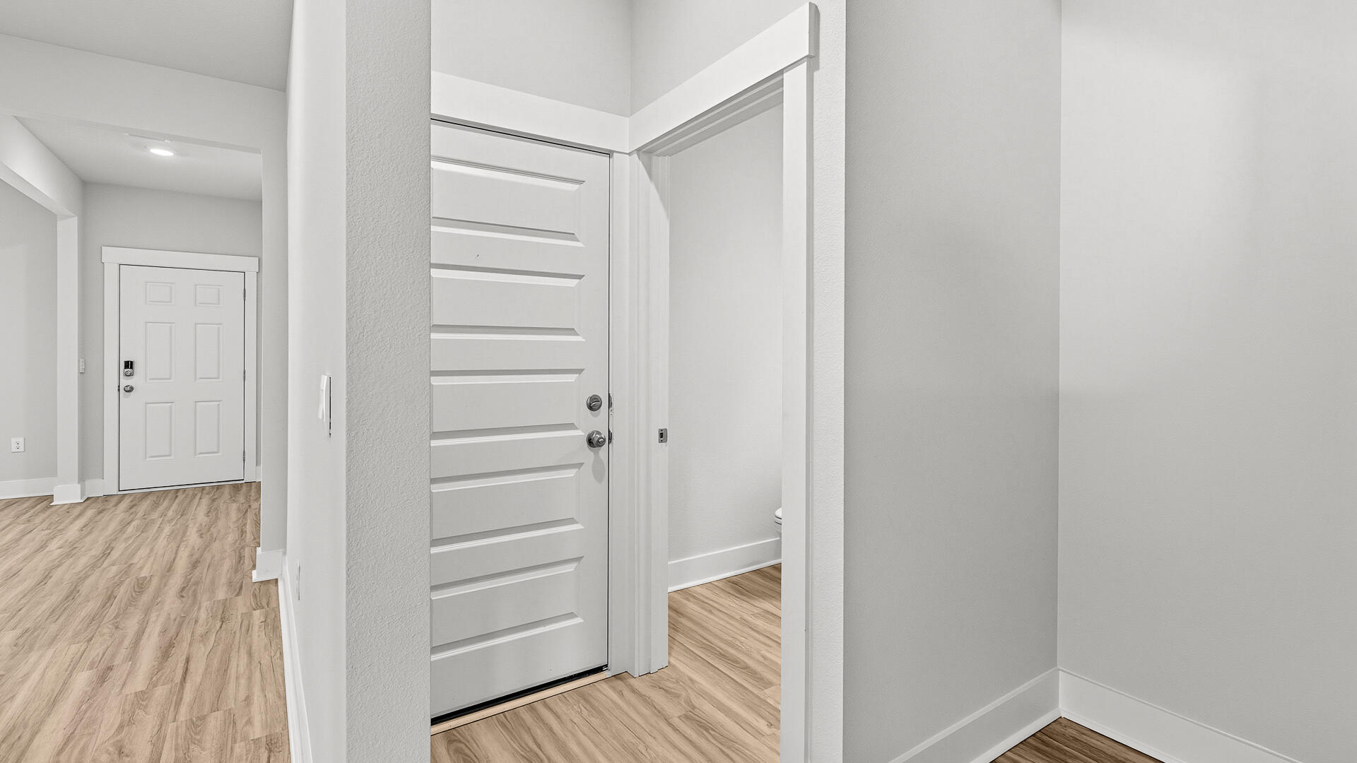 4610 Soldier Court Crestview, FL 32539 - Photo 18 of 33 a view of a hallway with wooden floor and closet