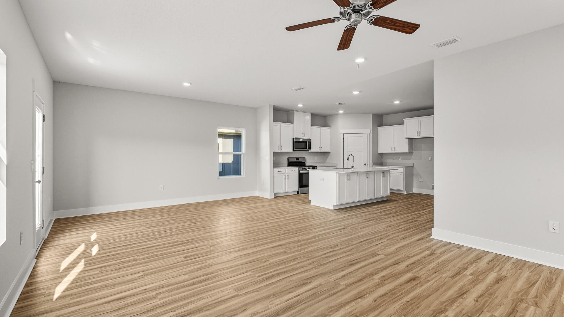 4610 Soldier Court Crestview, FL 32539 - Photo 7 of 33 a view of kitchen with wooden floor and window
