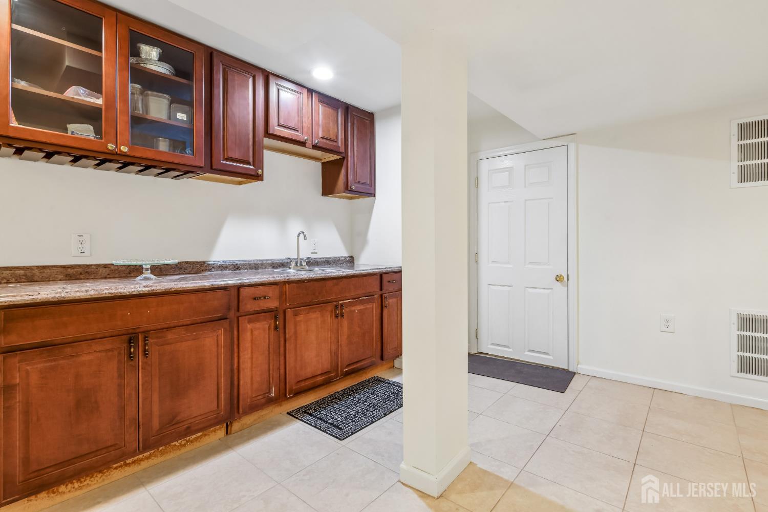 489 Plainfield Road Edison, NJ 08820 - Photo 34 of 39 a kitchen with granite countertop a sink and cabinets