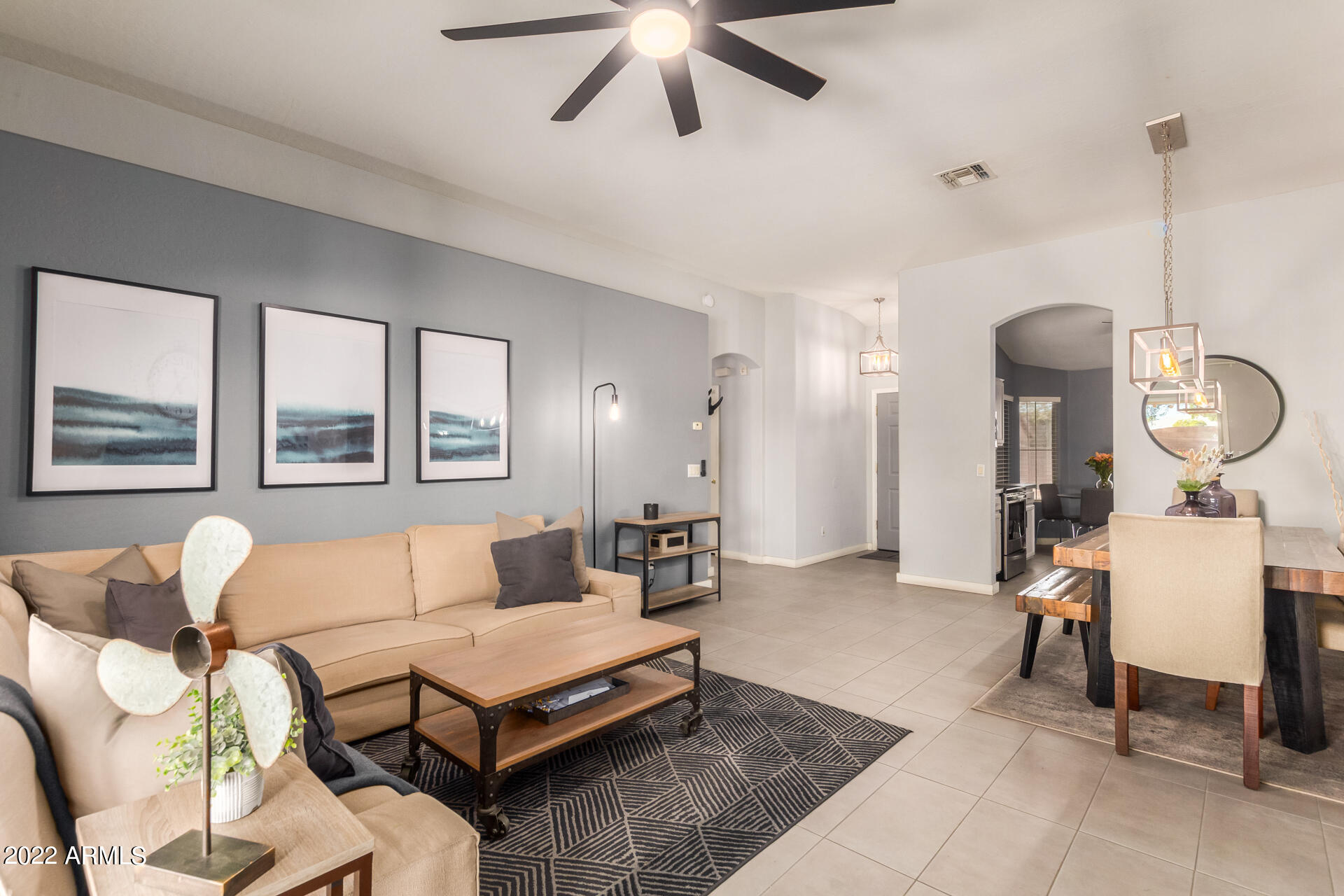 5515 South 15th Way Phoenix, AZ 85040 - Photo 11 of 28 a living room with furniture a window and a chandelier