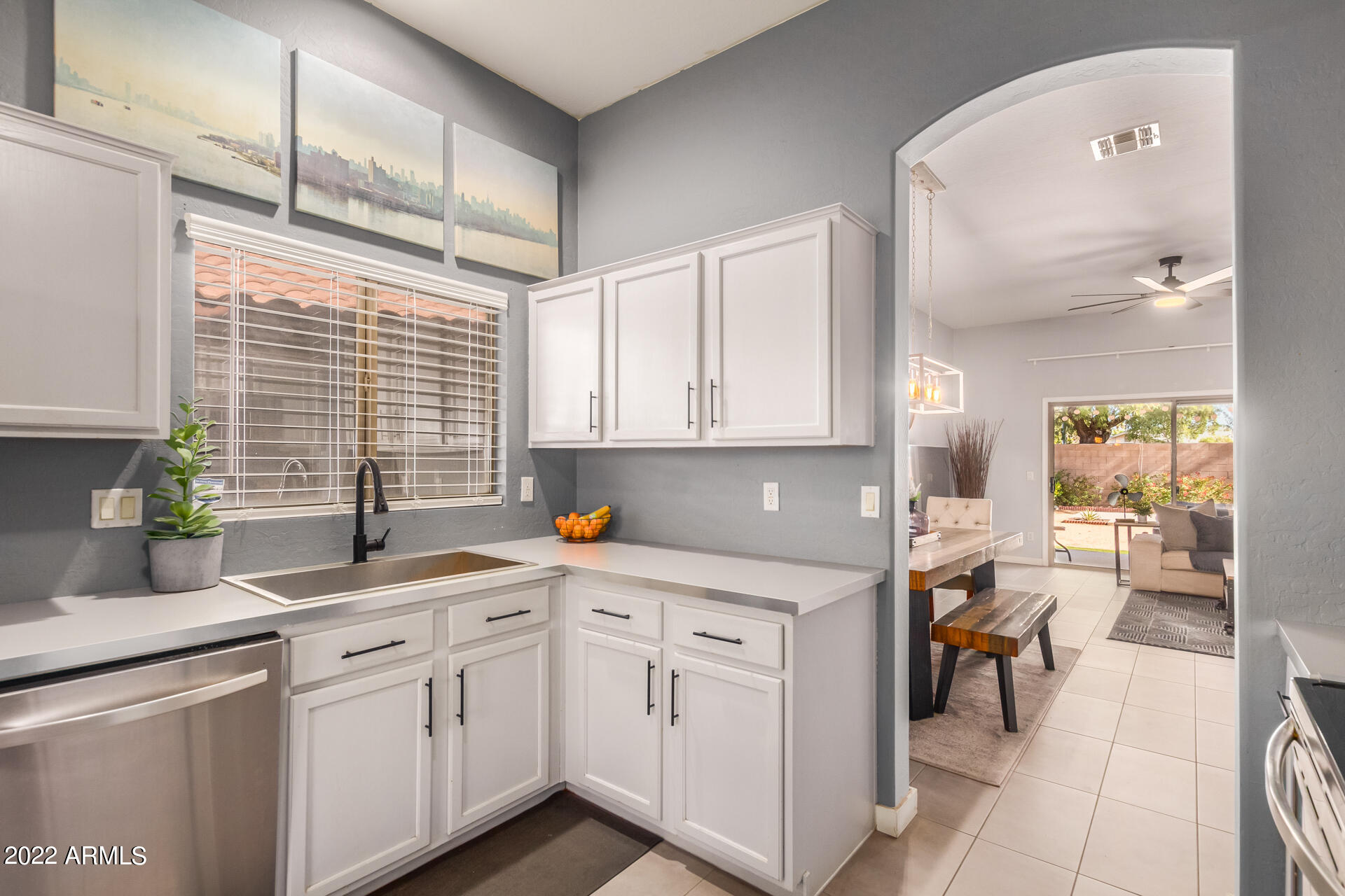 5515 South 15th Way Phoenix, AZ 85040 - Photo 16 of 28 a kitchen with white cabinets and white appliances