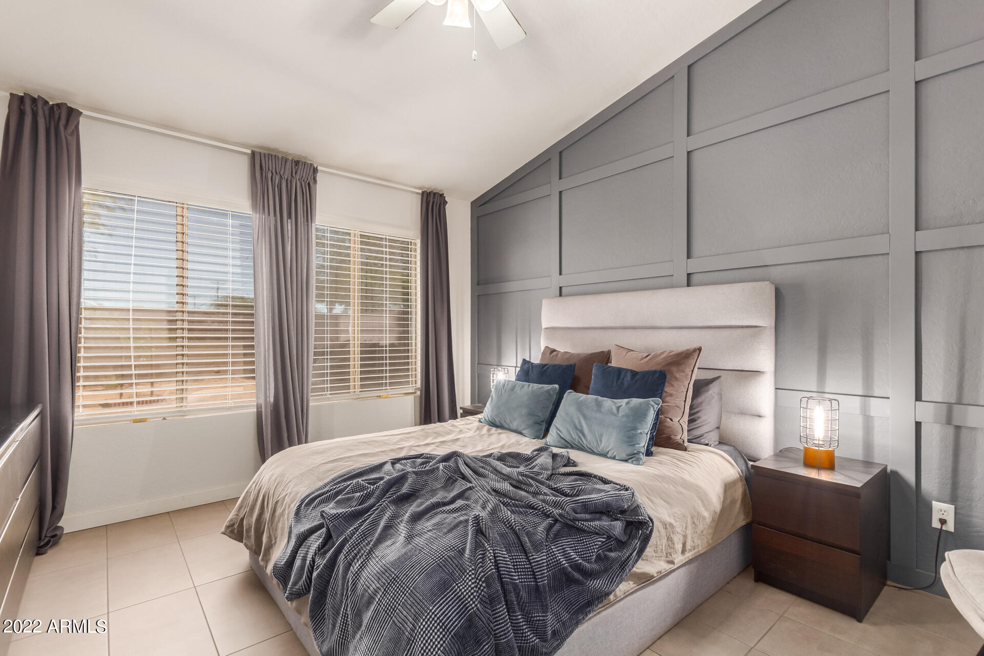 5515 South 15th Way Phoenix, AZ 85040 - Photo 17 of 28 a bedroom with a large bed and a window