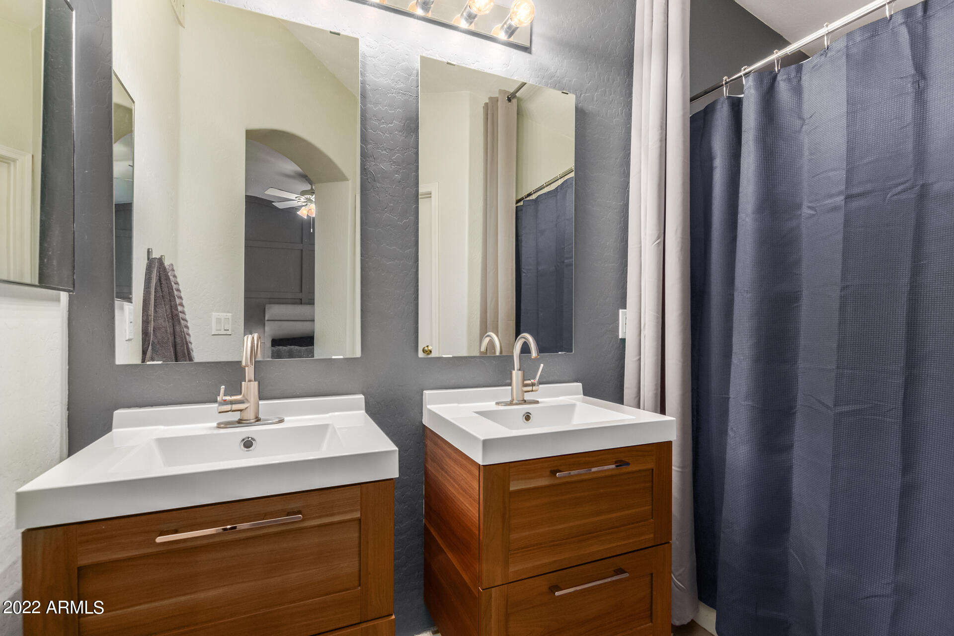 5515 South 15th Way Phoenix, AZ 85040 - Photo 20 of 28 a bathroom with a sink double vanity and a mirror