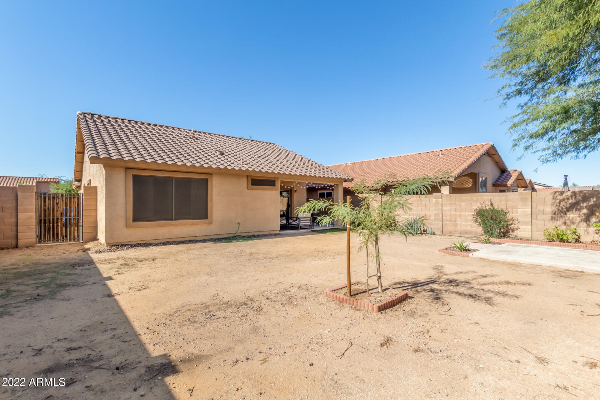 5515 South 15th Way Phoenix, AZ 85040 - Photo 27 of 28 a view of a house with wooden fence